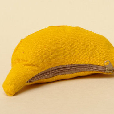 Three cheeky fun loving monkeys who happily live in their banana purse home