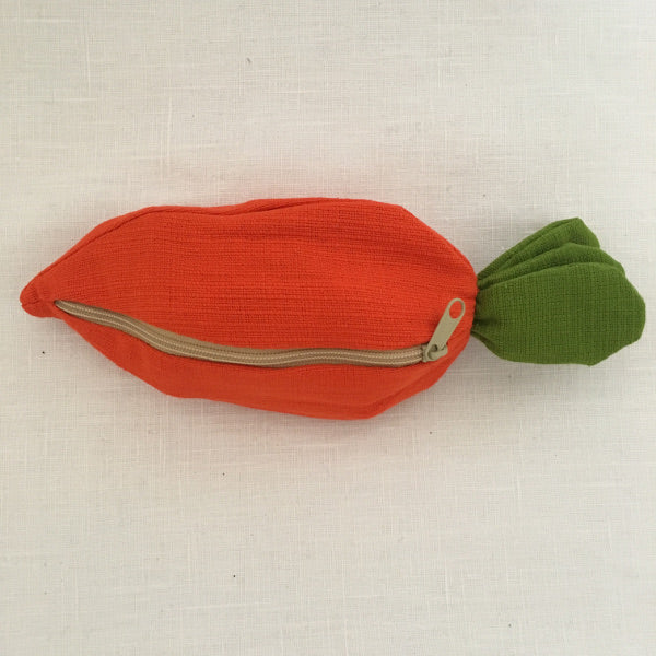 A carrot purse bursting with three bunnies