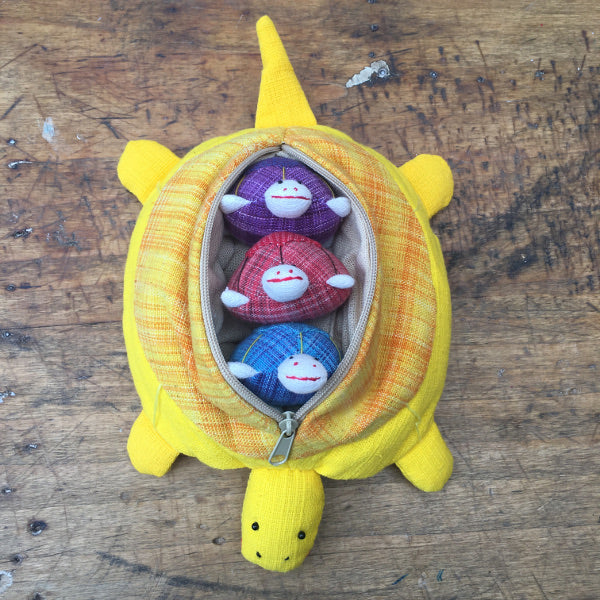 Mother tortoise and 3 removable baby tortoises