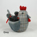 "Cluck  Cluck" marvellously plump Mother hen here with four small chicks safely nestled under her wings.