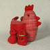 "Cluck  Cluck" marvellously plump Mother hen here with four small chicks safely nestled under her wings.